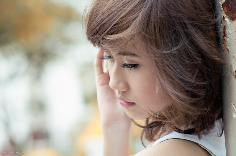 woman leaning against wall
