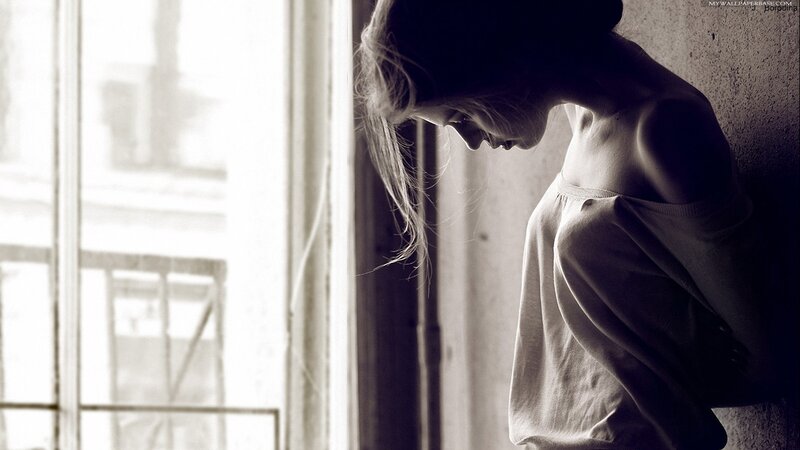 woman leaning against wall