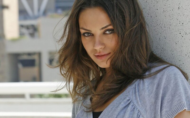 woman leaning against wall