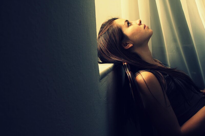 woman leaning against wall