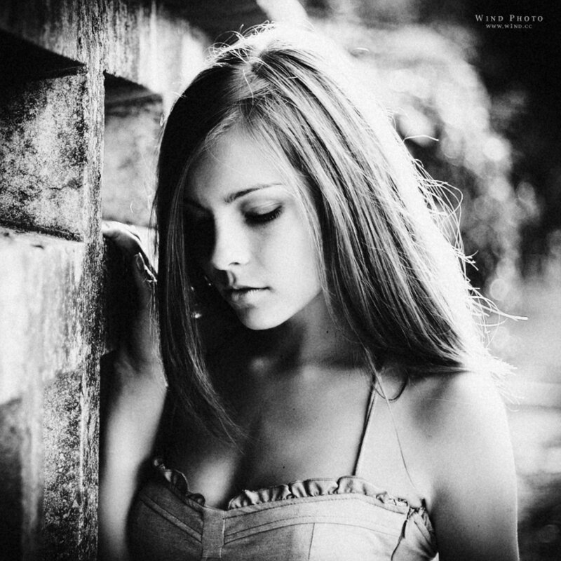 woman leaning against wall