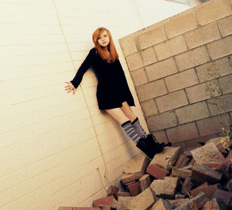 woman leaning against wall
