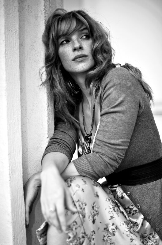 woman leaning against wall