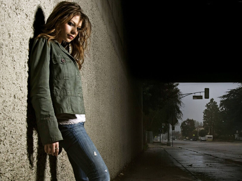 woman leaning against wall