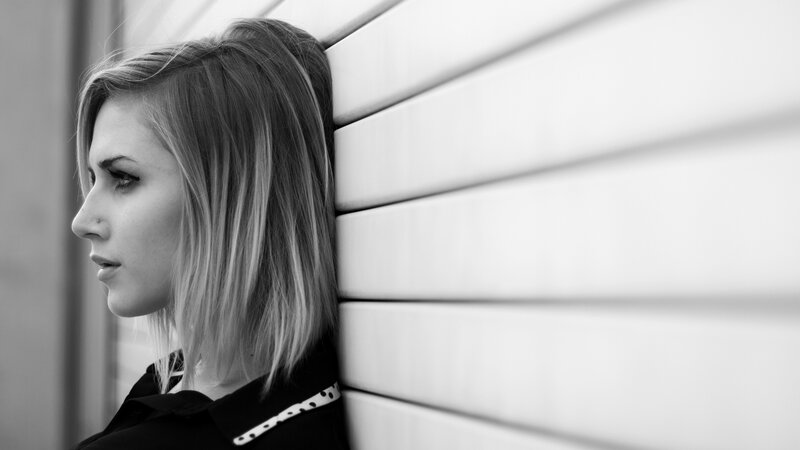 woman leaning against wall