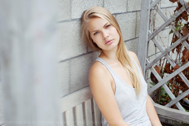 woman leaning against wall