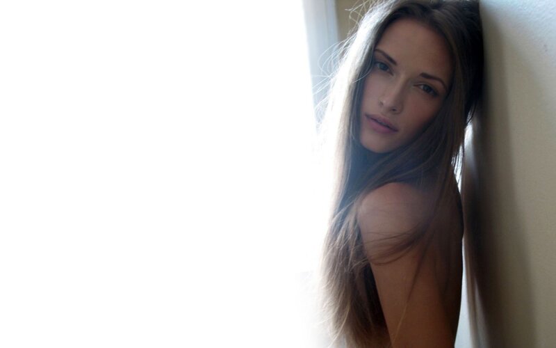 woman leaning against wall