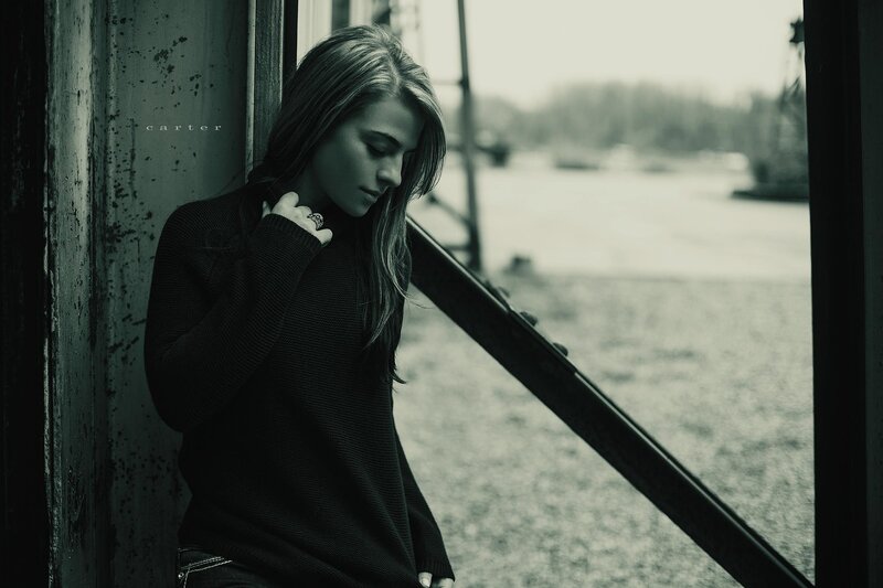 woman leaning against wall