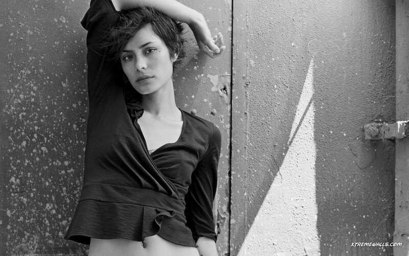 woman leaning against wall