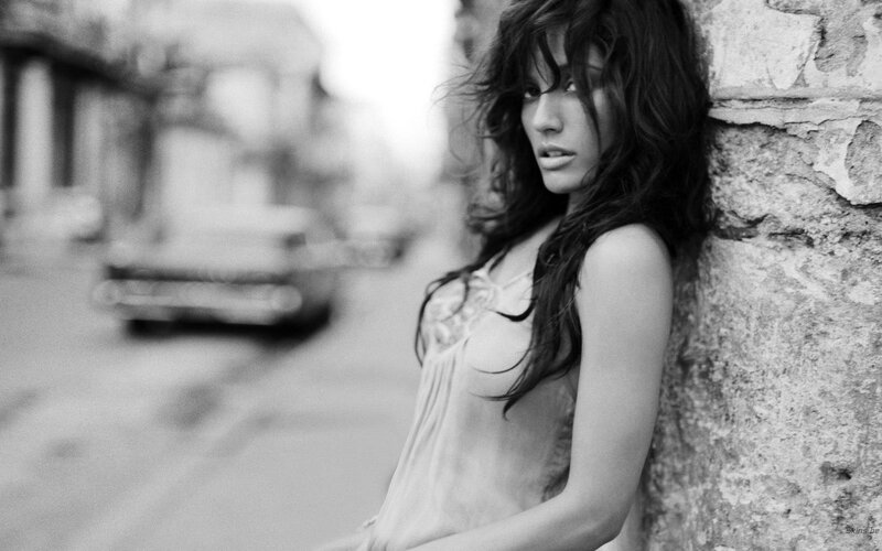 woman leaning against wall