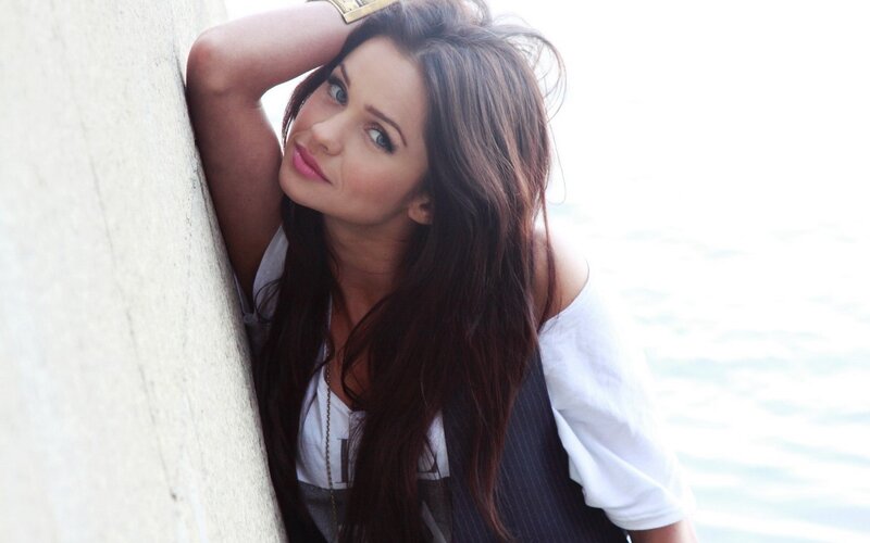 woman leaning against wall