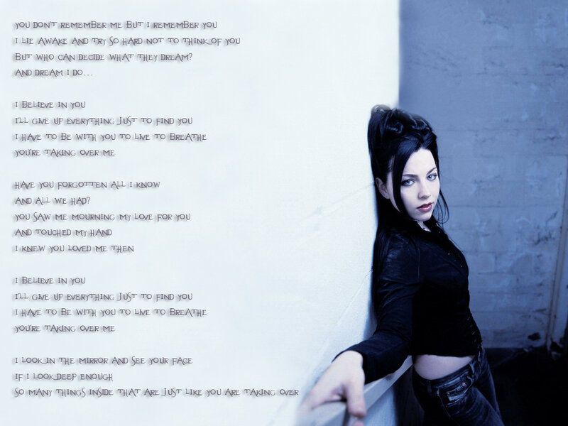 woman leaning against wall with lyrics