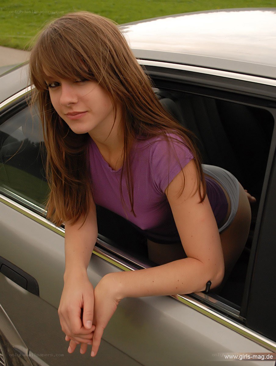 woman leaning from car window