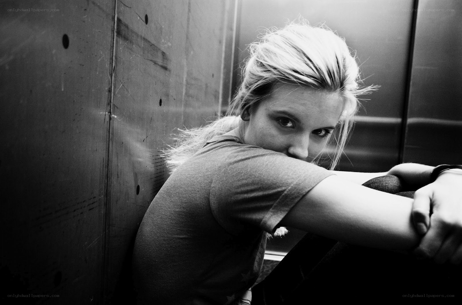 woman leaning in elevator