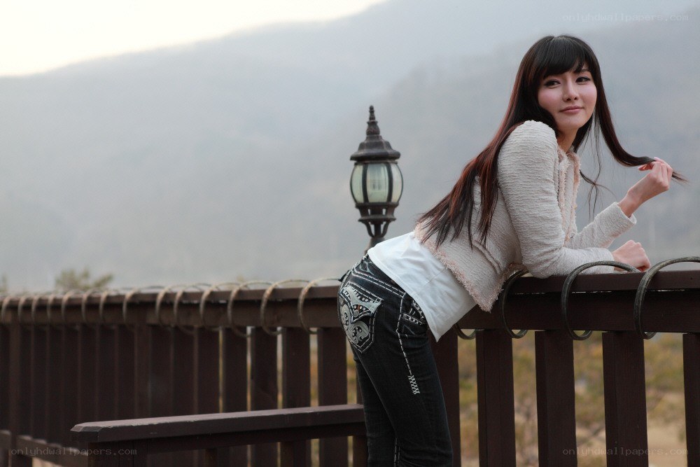 Woman leaning on a railing