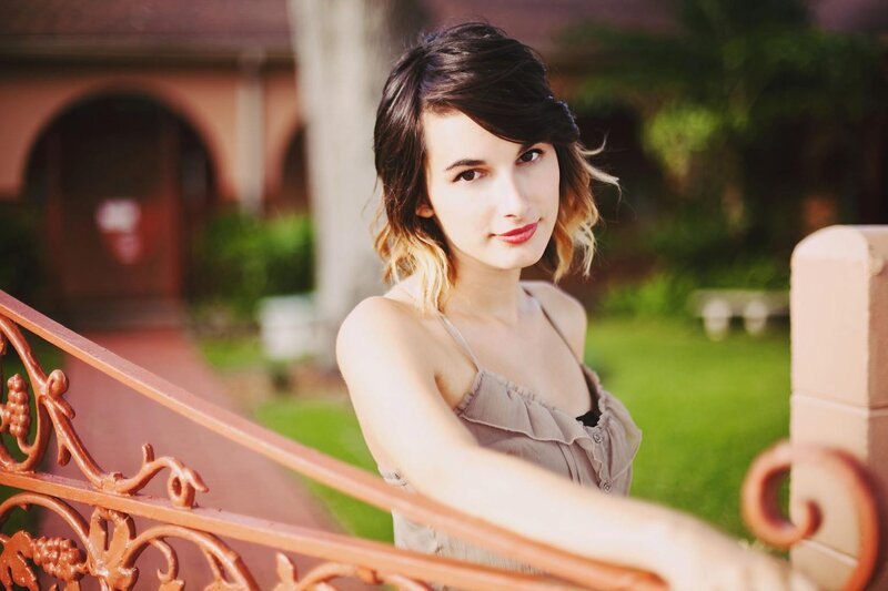 woman leaning on a railing