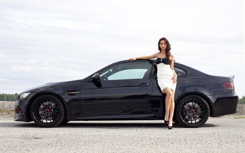Woman Leaning on Black Car — Calm, Afternoon, Photograph