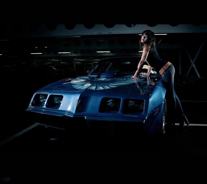Woman Leaning on Blue Car — Dramatic, Night