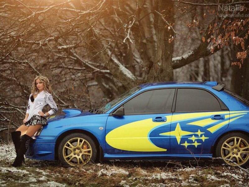 Woman Leaning on Blue Car — Dramatic, Winter