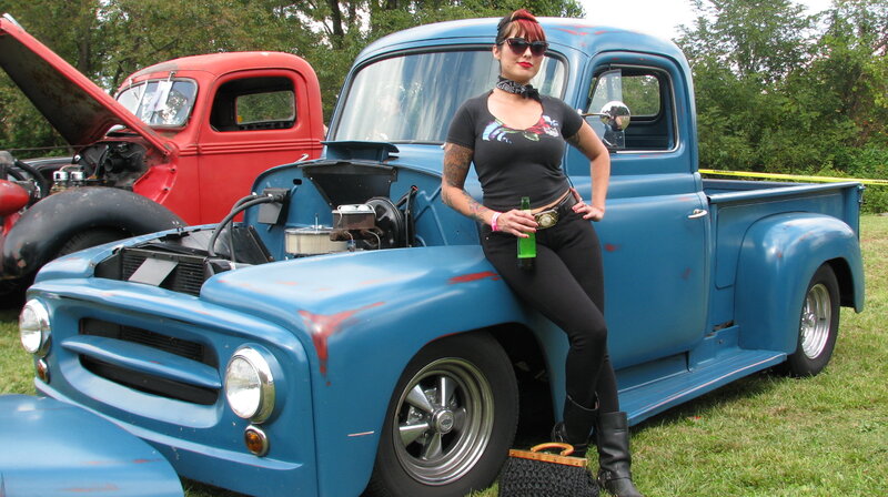 Woman Leaning on Blue Truck