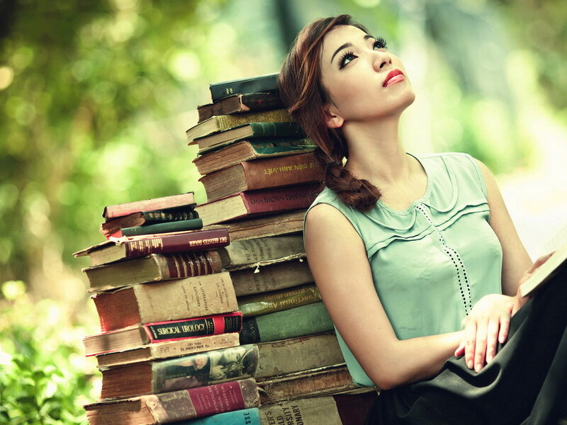 Woman Leaning on Books