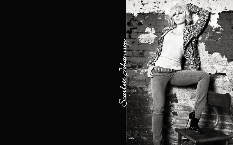 Woman Leaning on Brick Wall — Black, Confident