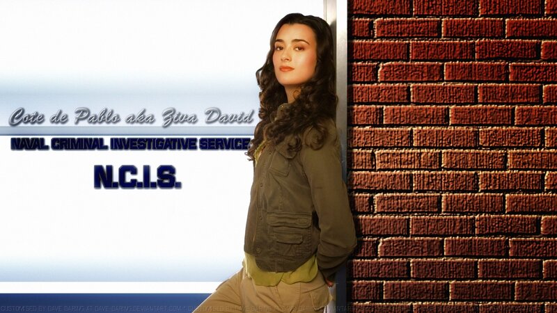 Woman Leaning on Brick Wall — Brown, Serious