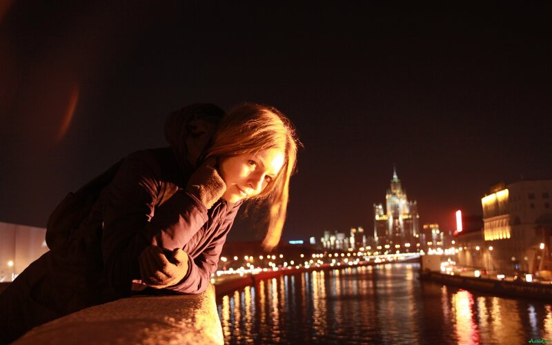 Woman Leaning on Bridge