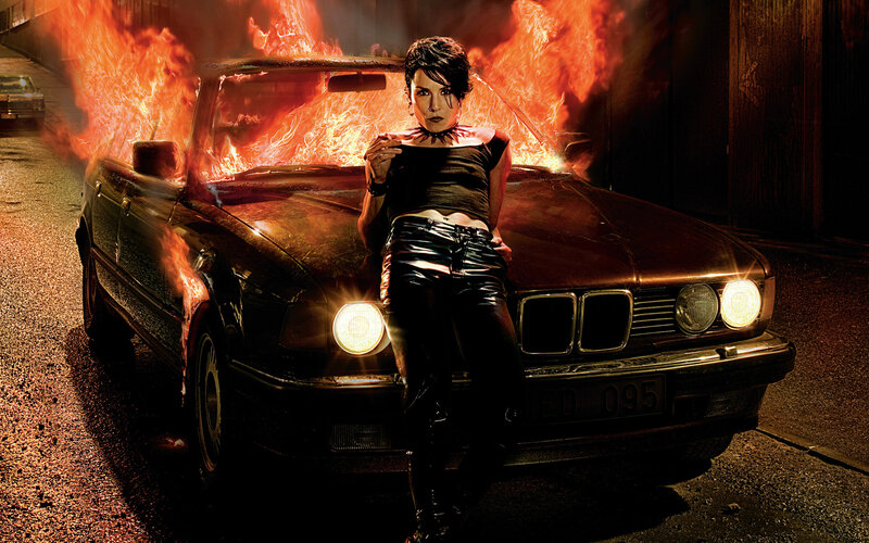 Woman Leaning on Burning Car