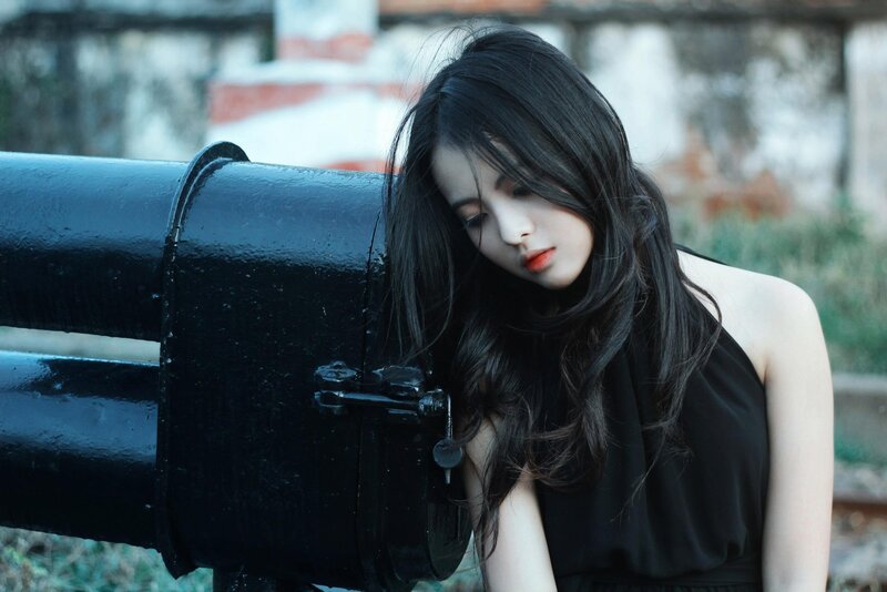 woman leaning on cannon