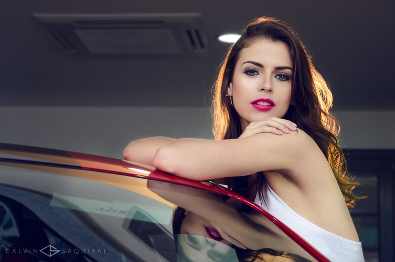 woman leaning on car