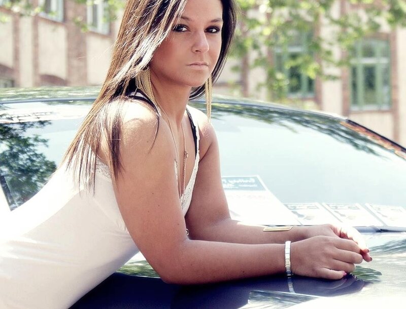 woman leaning on car