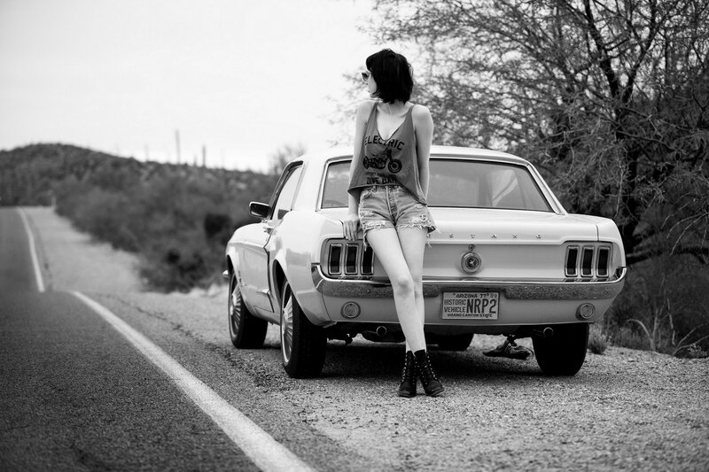 Woman Leaning on Car — Black, Contemplative