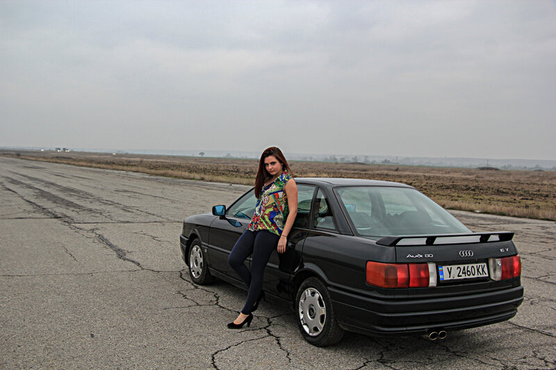 Woman Leaning on Car — Black, Overcast