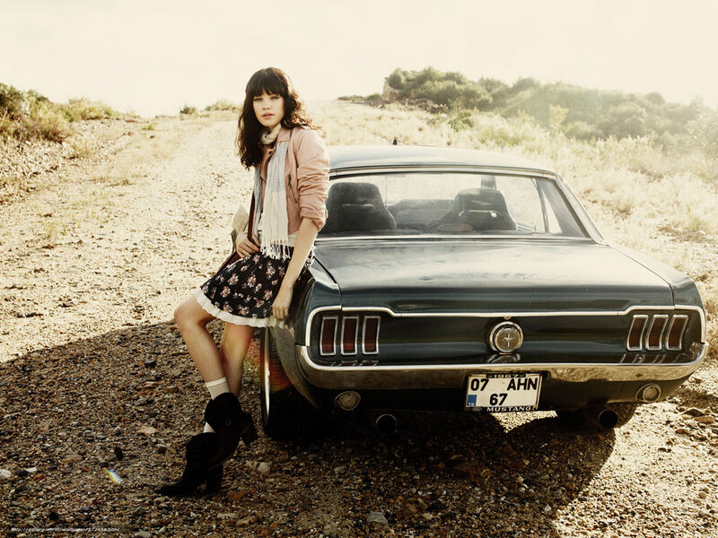 Woman Leaning on Car — Brown, Serene