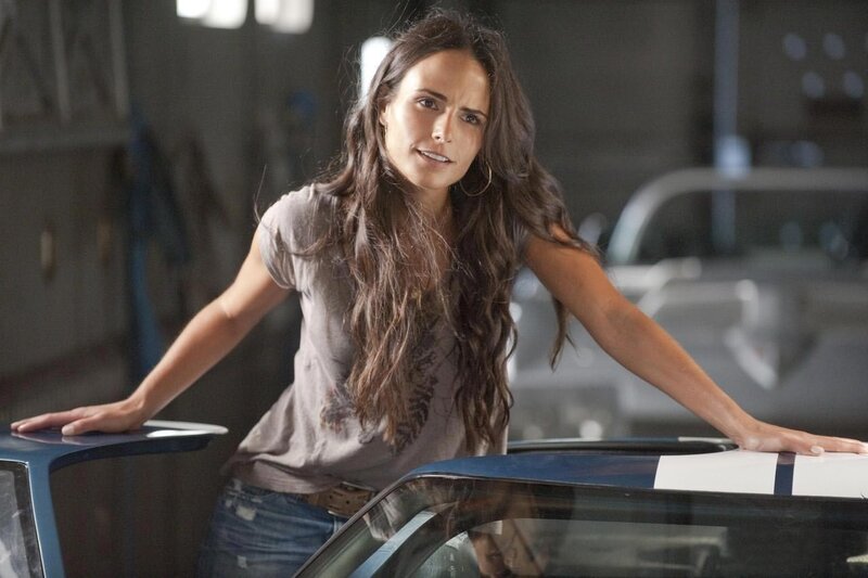 woman leaning on car in garage