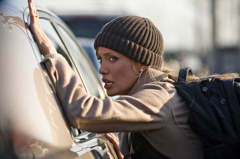 Woman leaning on car window