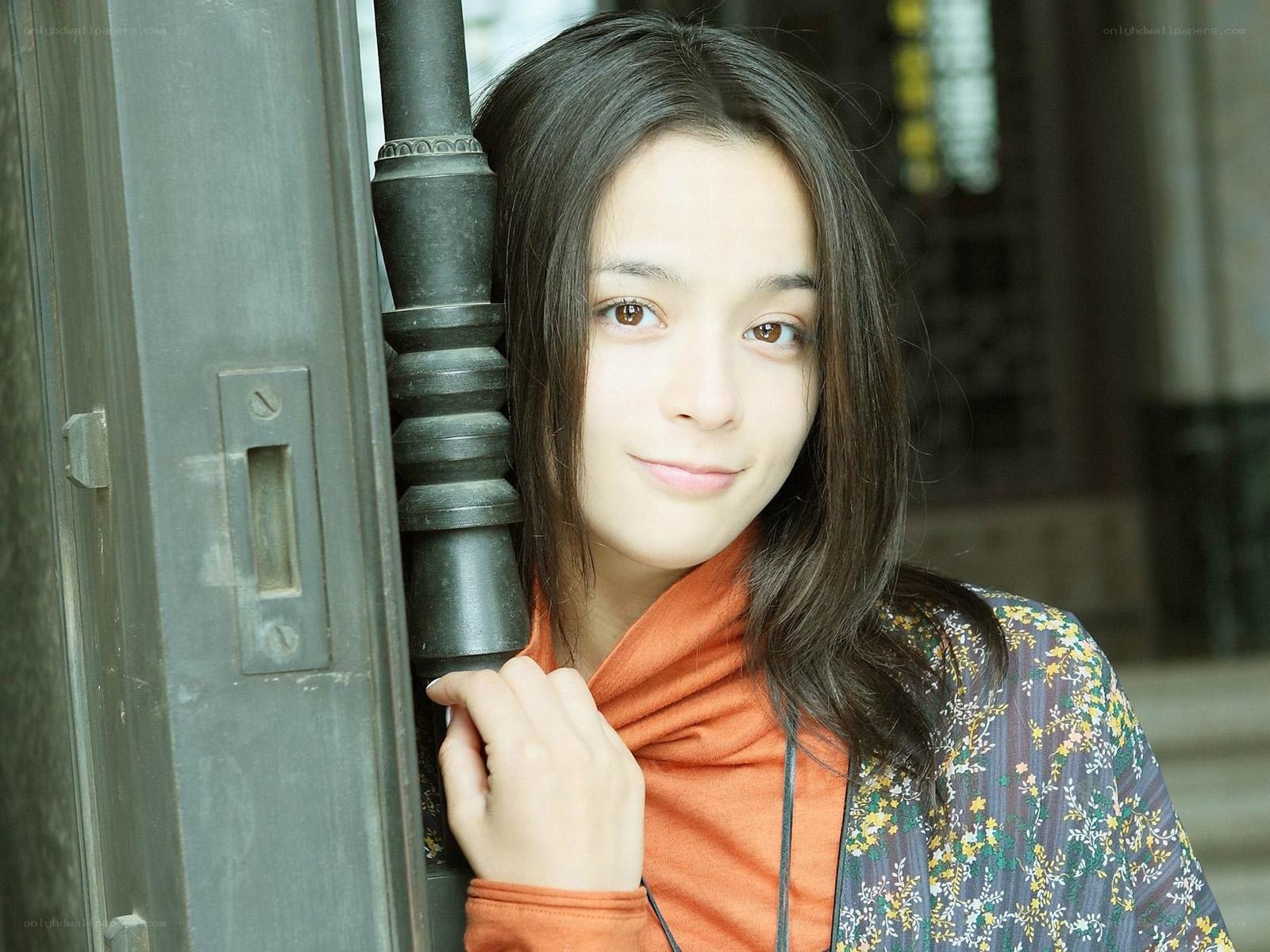 woman leaning on door frame