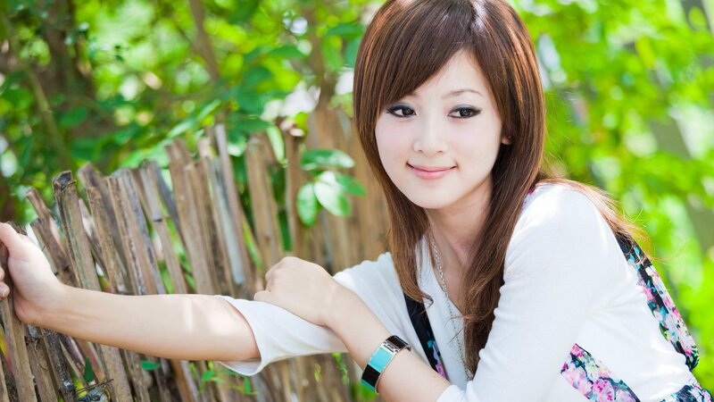 Woman Leaning on Fence — Green, Calm, Afternoon