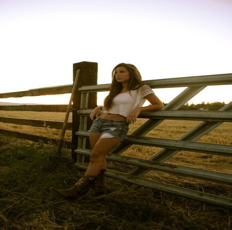 Woman Leaning on Gate