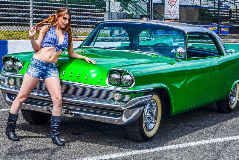 Woman Leaning on Green Car — Confident