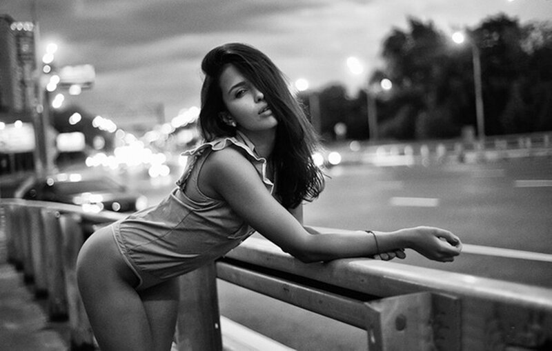 Woman Leaning on Guardrail