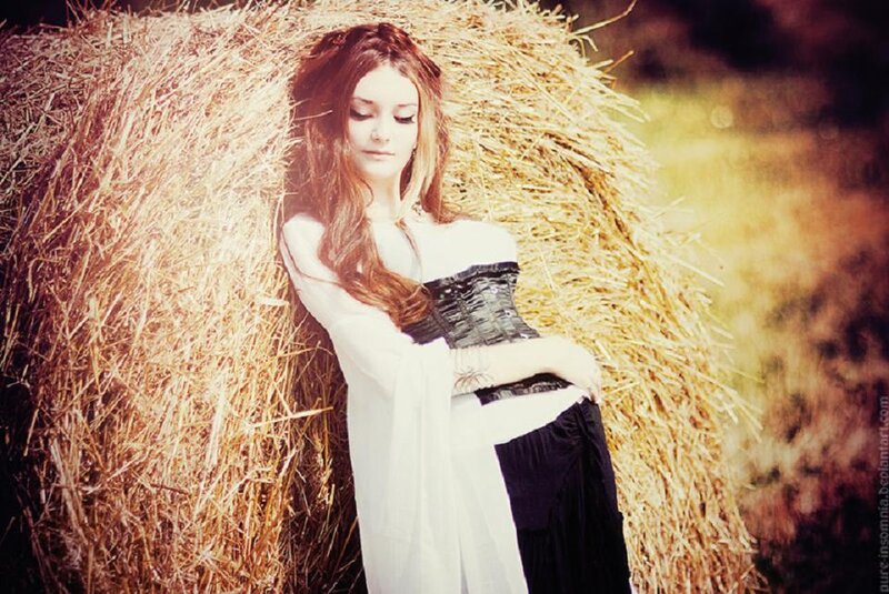 Woman Leaning on Hay Bale — White