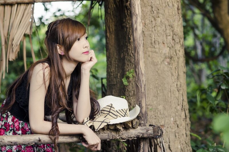 Woman Leaning on Log — Green