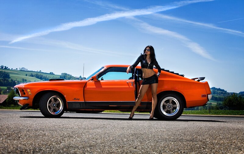 Woman Leaning on Orange Car — Dramatic, Afternoon, Photograph, Sunglasses