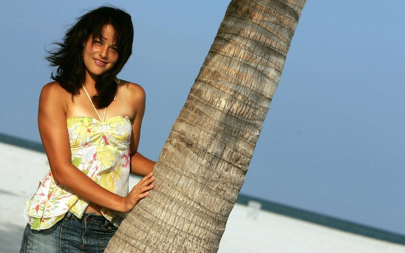Woman Leaning on Palm Tree — Blue