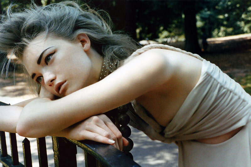 woman leaning on park bench