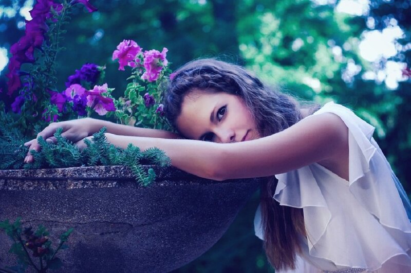 Woman Leaning on Planter