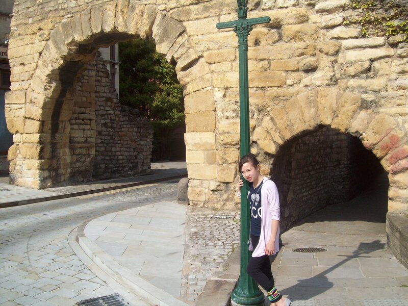 Woman Leaning on Pole — Brown