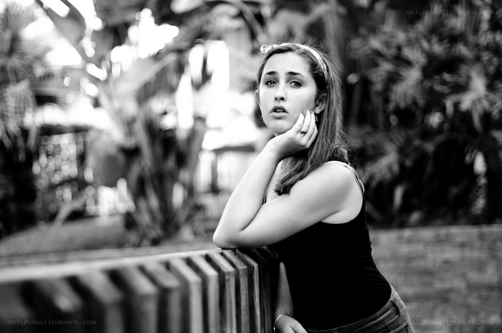 woman leaning on railing
